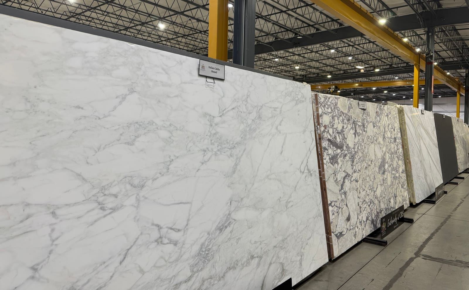 Rows of granite and quartz slabs racked for selection