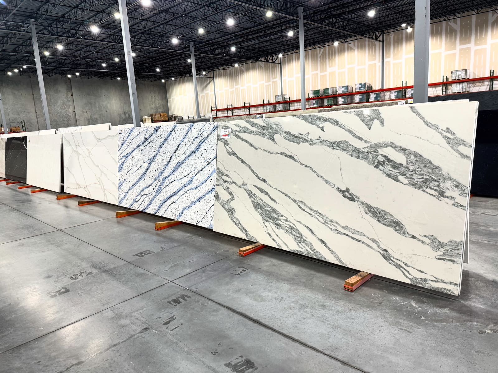 Calacatta quartz slabs staged in the fabrication warehouse